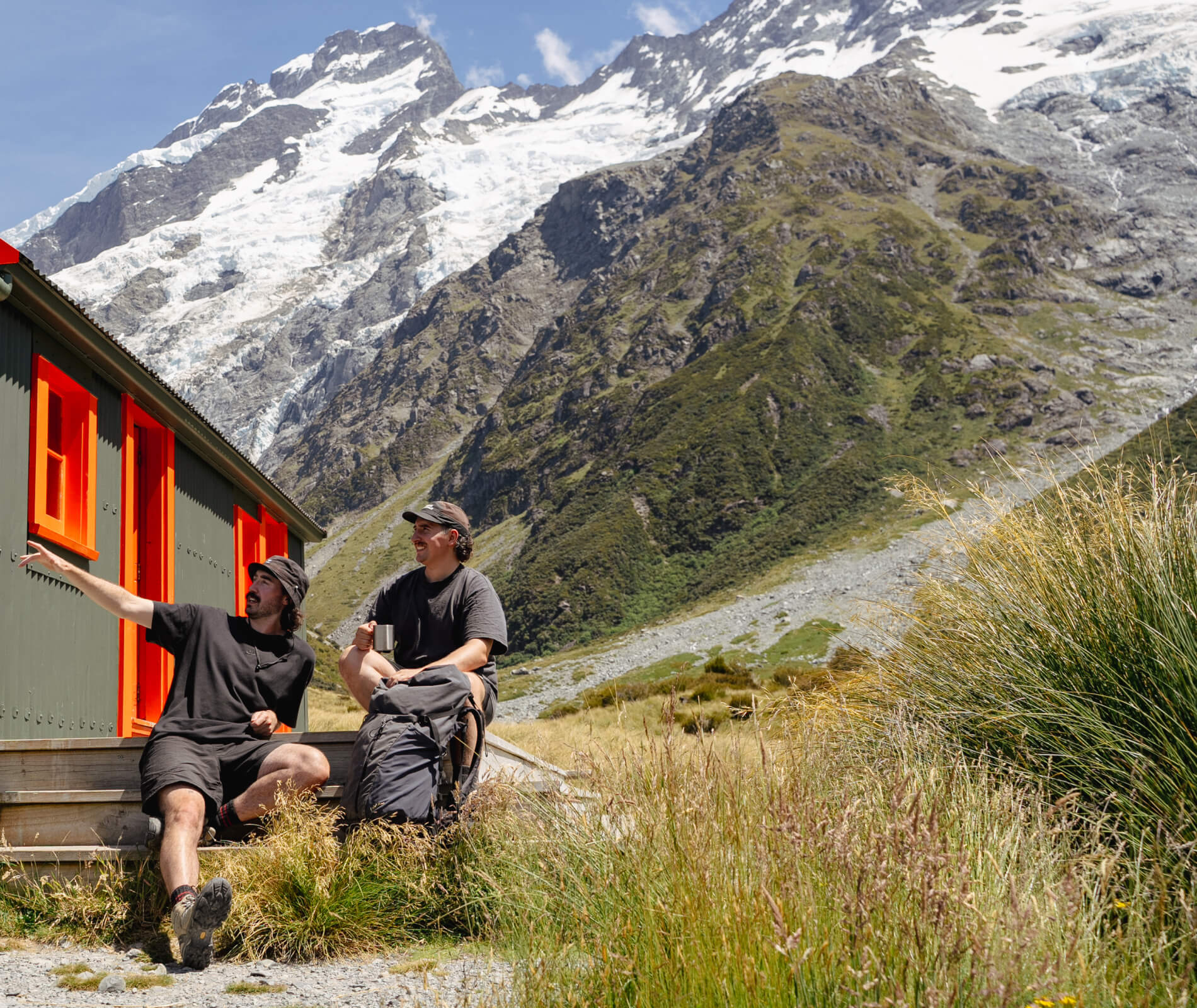 Two hikers enjoying Easys cocktails on a scenic mountain trail, highlighting the perfect drink for outdoor adventures.