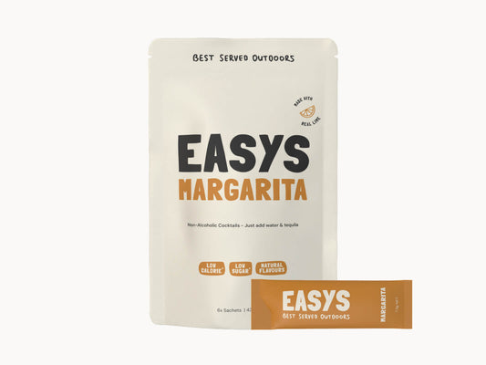 Easys Margarita 6-pack of powdered cocktail mix sachets, with a single sachet in front. Studio photo on a white background.