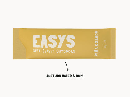 Single Easys Pina Colada powdered cocktail mix sachet, on it's side on a white background. 